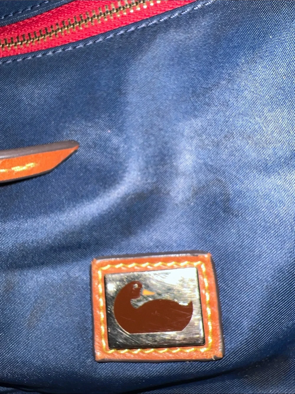 Dooney & Bourke Navy Nylon Messenger Bag with Brown Leather Trim and Red Accents